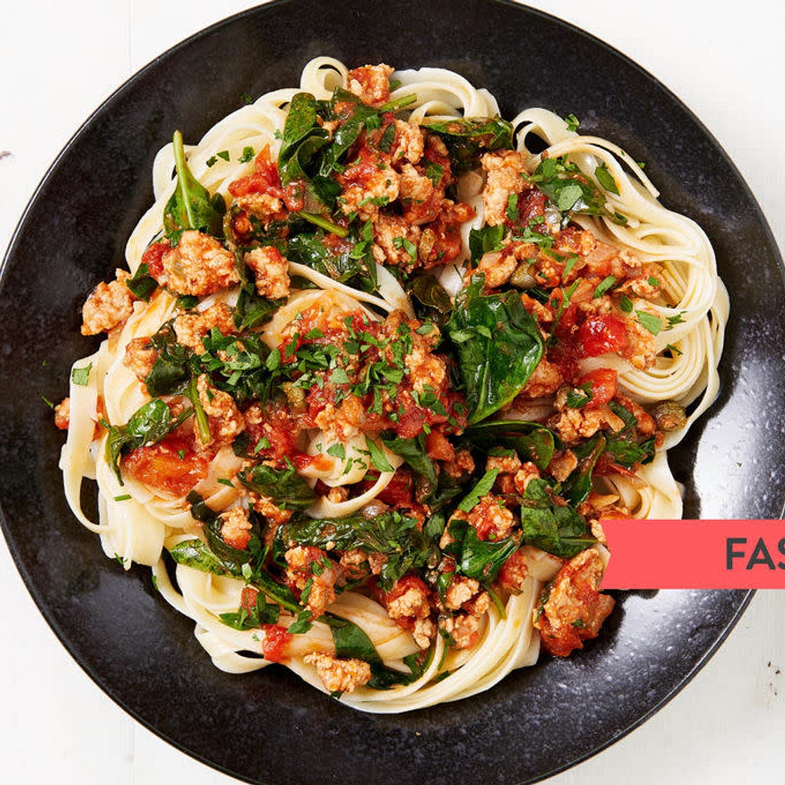Tuscan Pork Tagliatelle with Tomato, Capers and Spinach