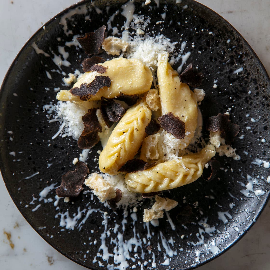 Black truffle Culurgiones with Grana Padano