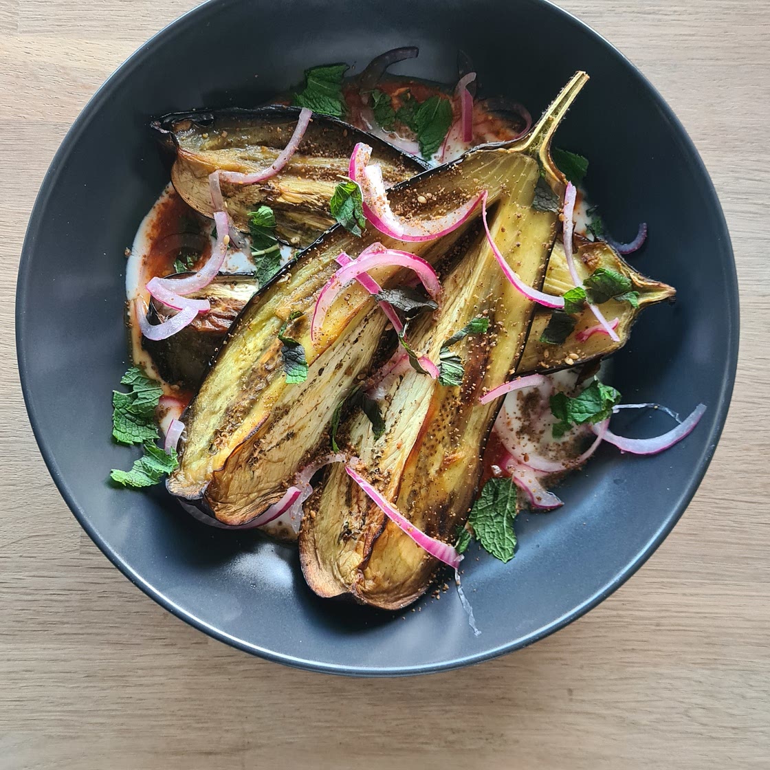 Roasted aubergine with Harissa and pickled onions