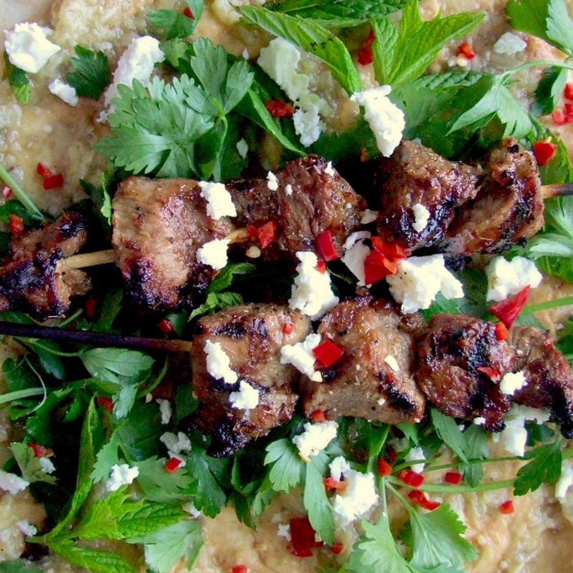 Barbecued lamb, smoky aubergine and feta wraps