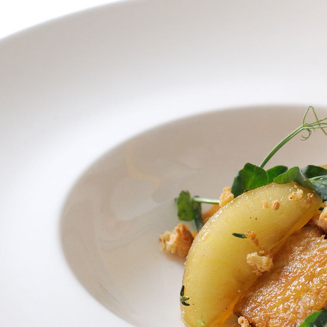 Pumpkin velouté with chicken wings, apples and almonds