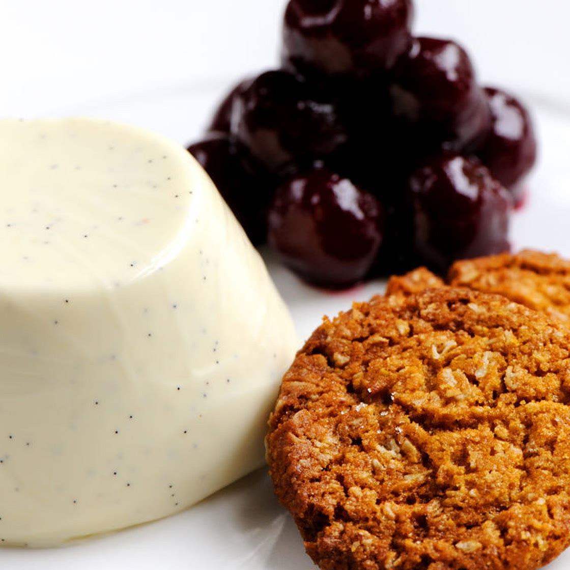 Cherries jubilee with vanilla and yoghurt panna cotta