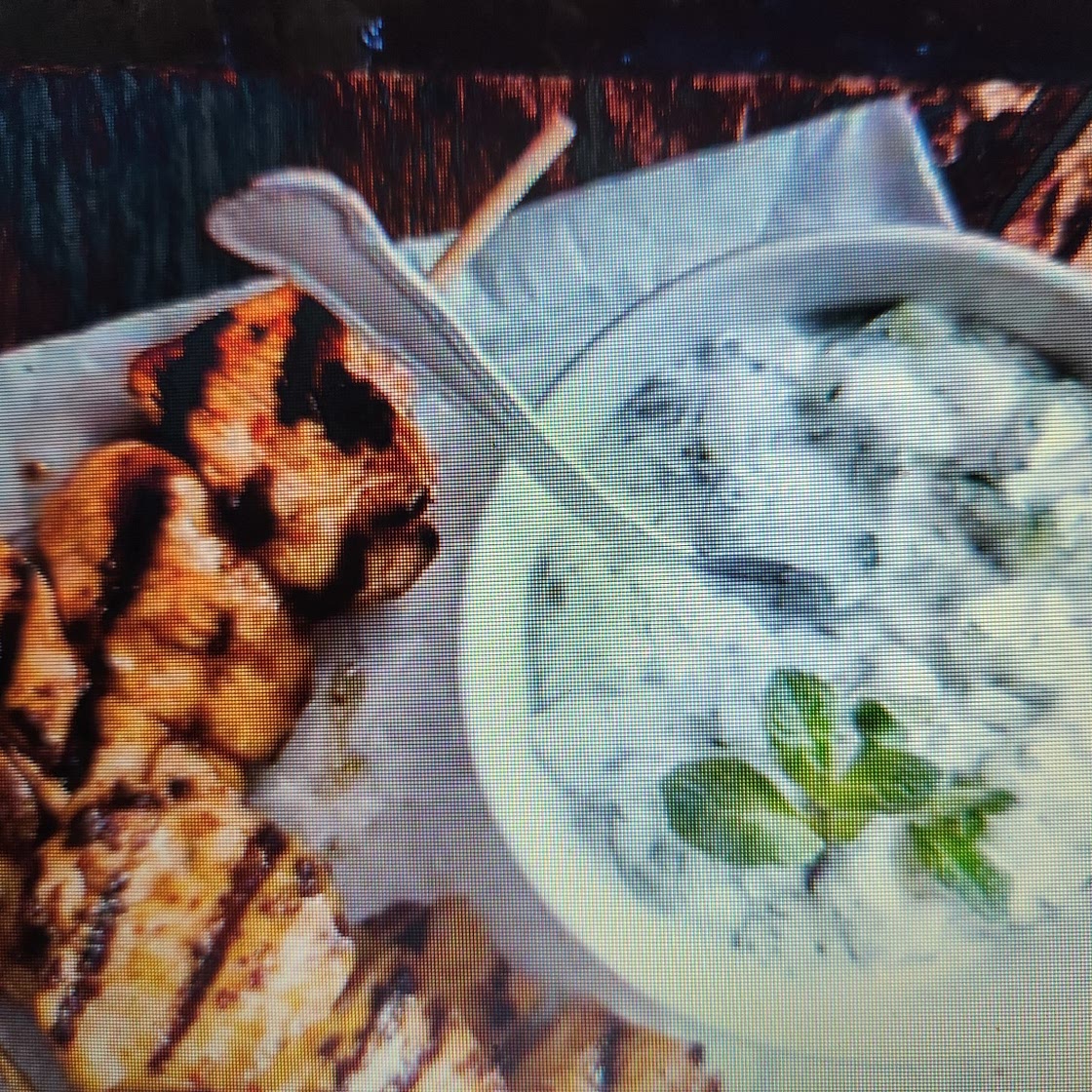 Chicken skewers with yoghurt dip and salad