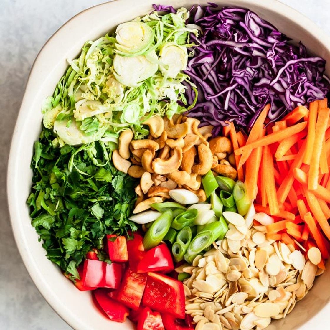 Cashew Crunch Shredded Brussels Sprouts Salad with Sesame Ginger Dressing