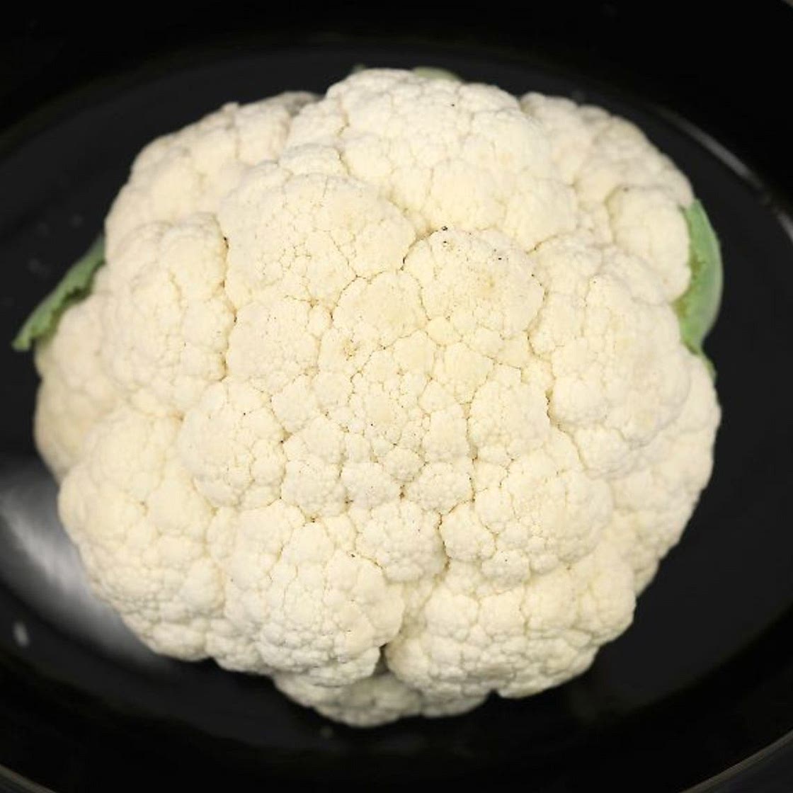 Place whole cauliflower in a slow cooker & have a tasty meal in no time