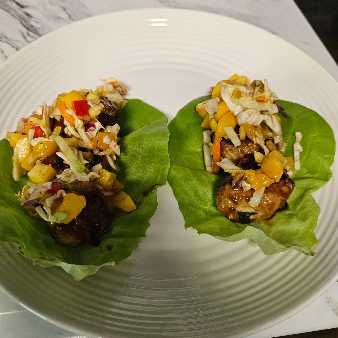 Asian Chicken Meatball Lettuce wraps with a mango slaw