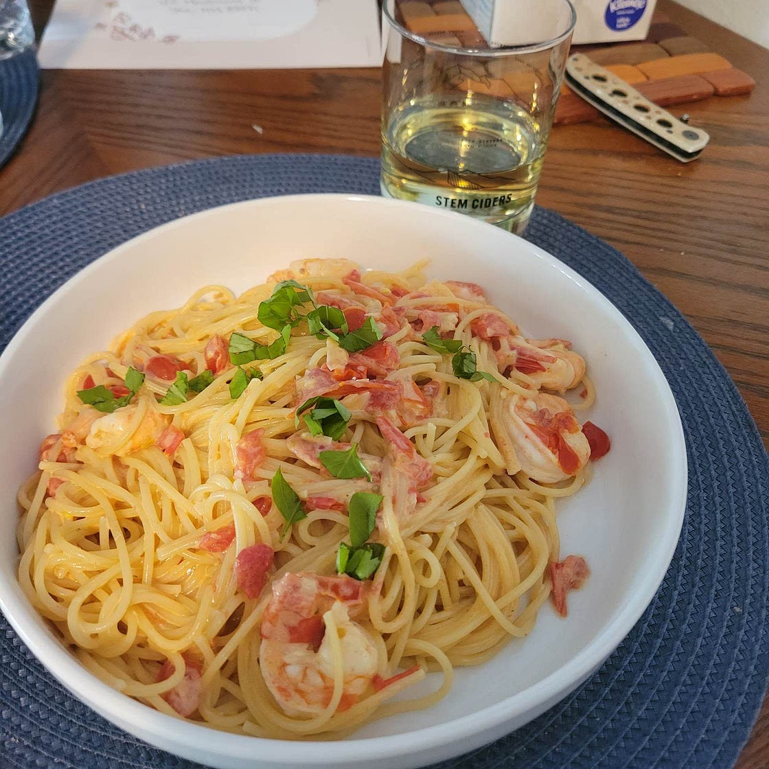 Creamy tomato shrimp spaghetti with basil
