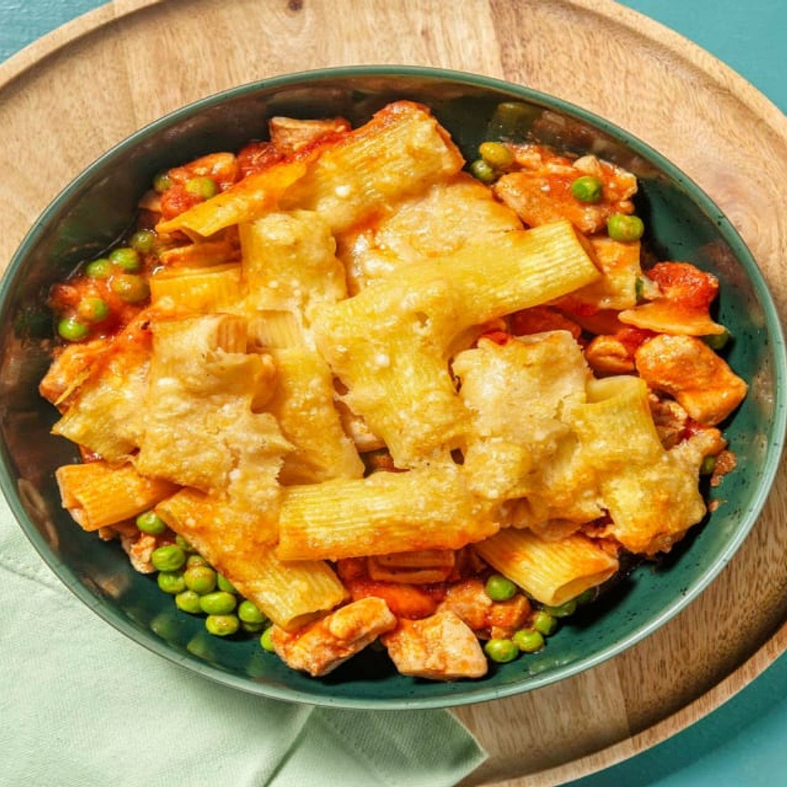 Layered Creamy Chicken Pasta Bake with Tomato Sauce, Peas and Cheese