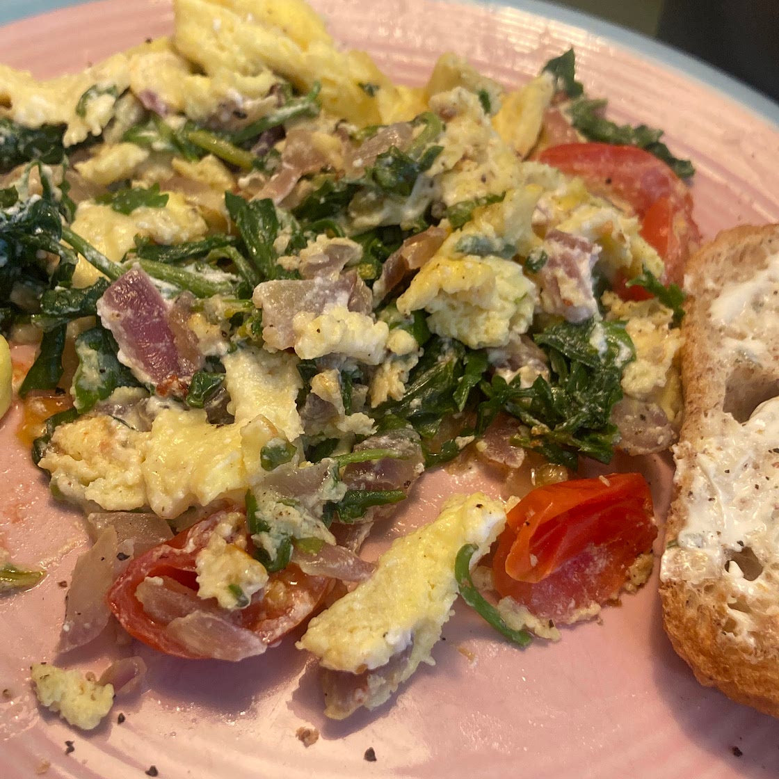 Arugula and Goat cheese breakfast scramble