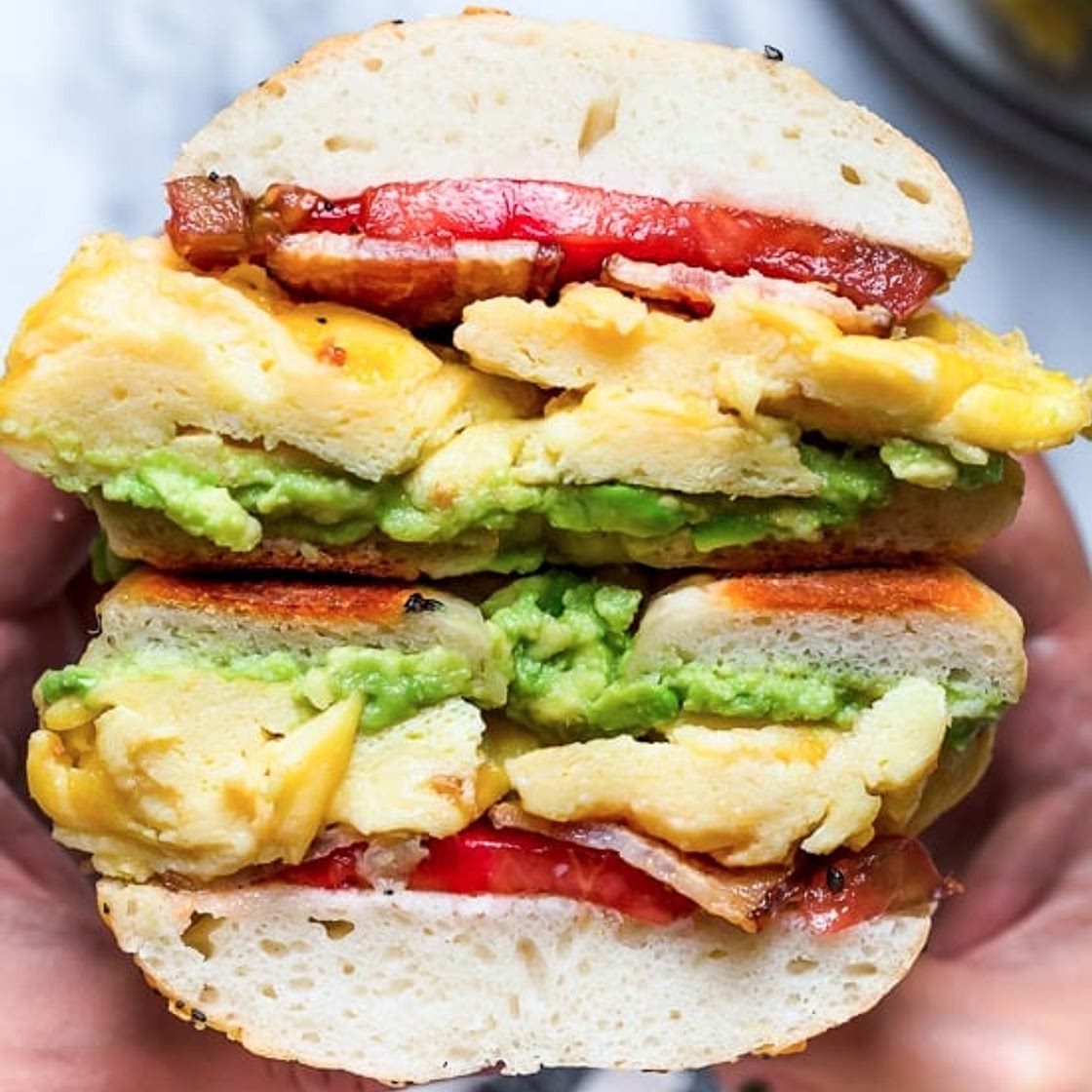 Bacon Egg and Avocado Bagel Breakfast Sandwich