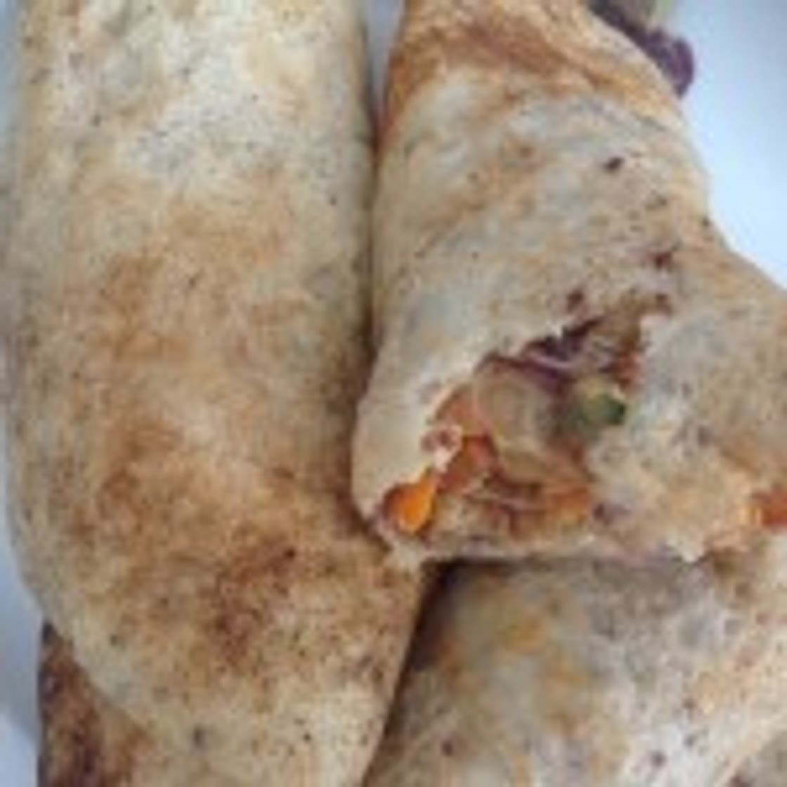 Pancakes filled with Carrots, Onions and Peas in Soft Cheese