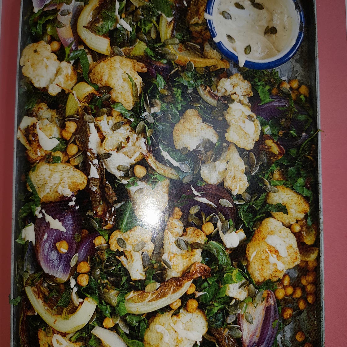 Roasted cauliflower with chickpeas, spring greens, lemon and tahini