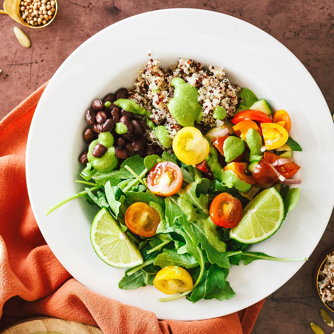 Meal Prep Quinoa, Black Bean, Arugula Bowl with an Herby Poblano Green Dressing