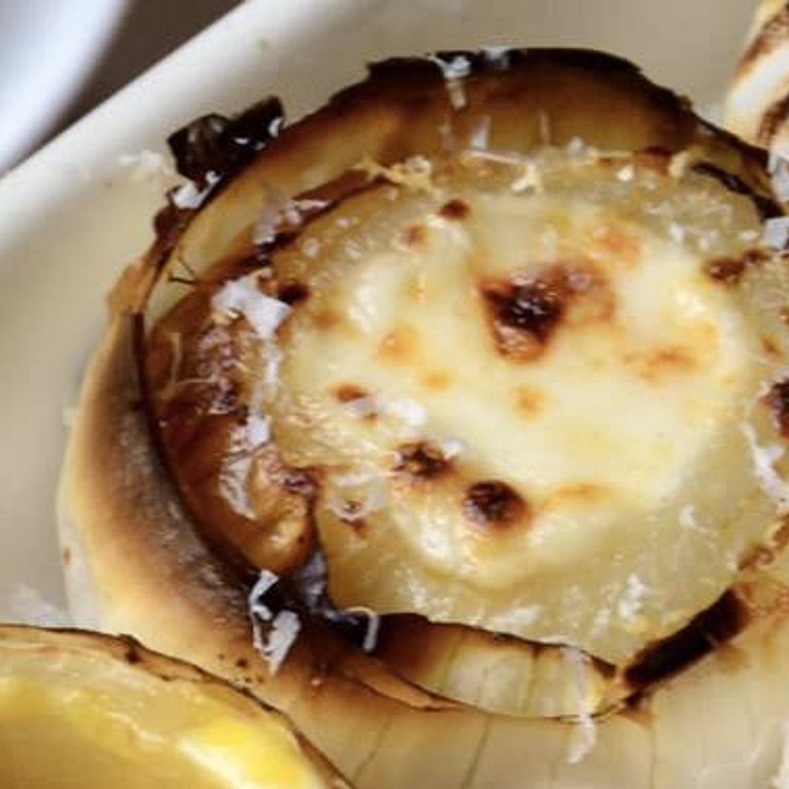 Stuffed onion with Grana Padano and black truffle