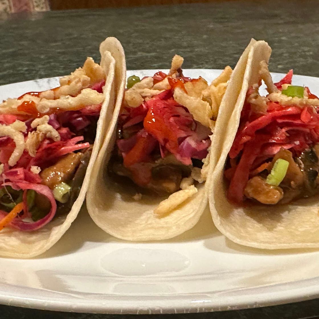 Beef Stir-fry Tacos w/tangy slaw, sriracha mayo & crispy onions