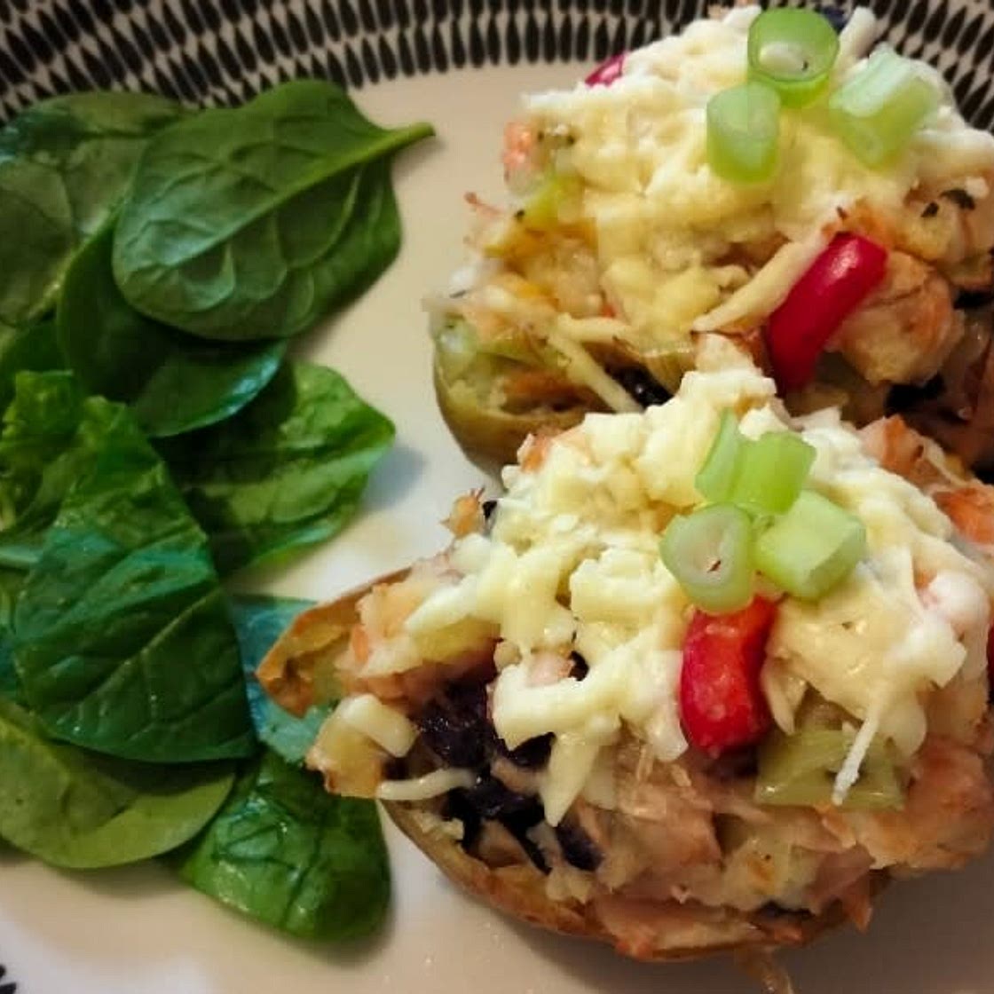 Cheesy salmon and leek stuffed potato skins