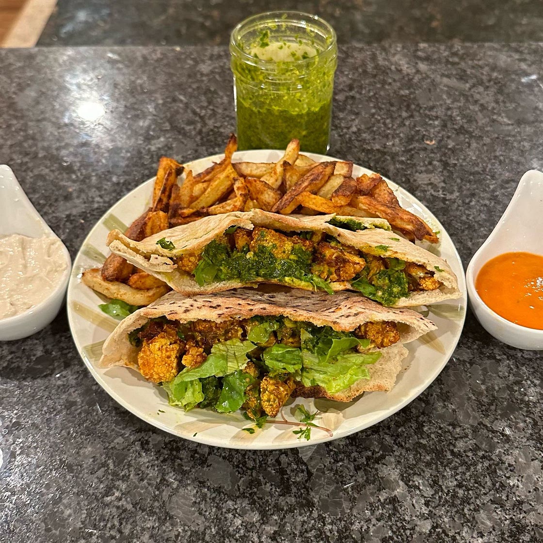 Roasted Cauliflower Pitas with Zhug and Garlic Tahini