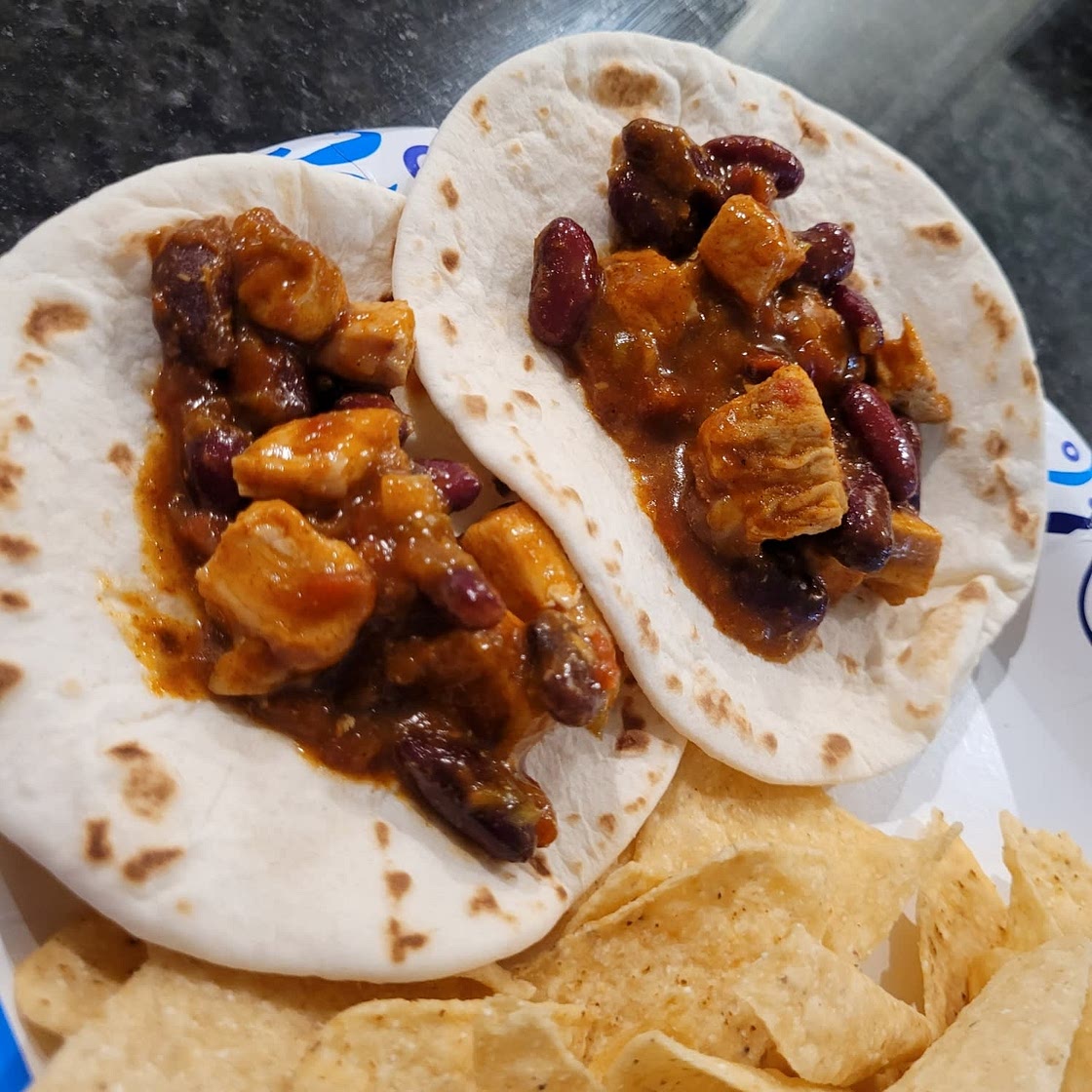 Chicken Chili Tacos with beans and sour cream