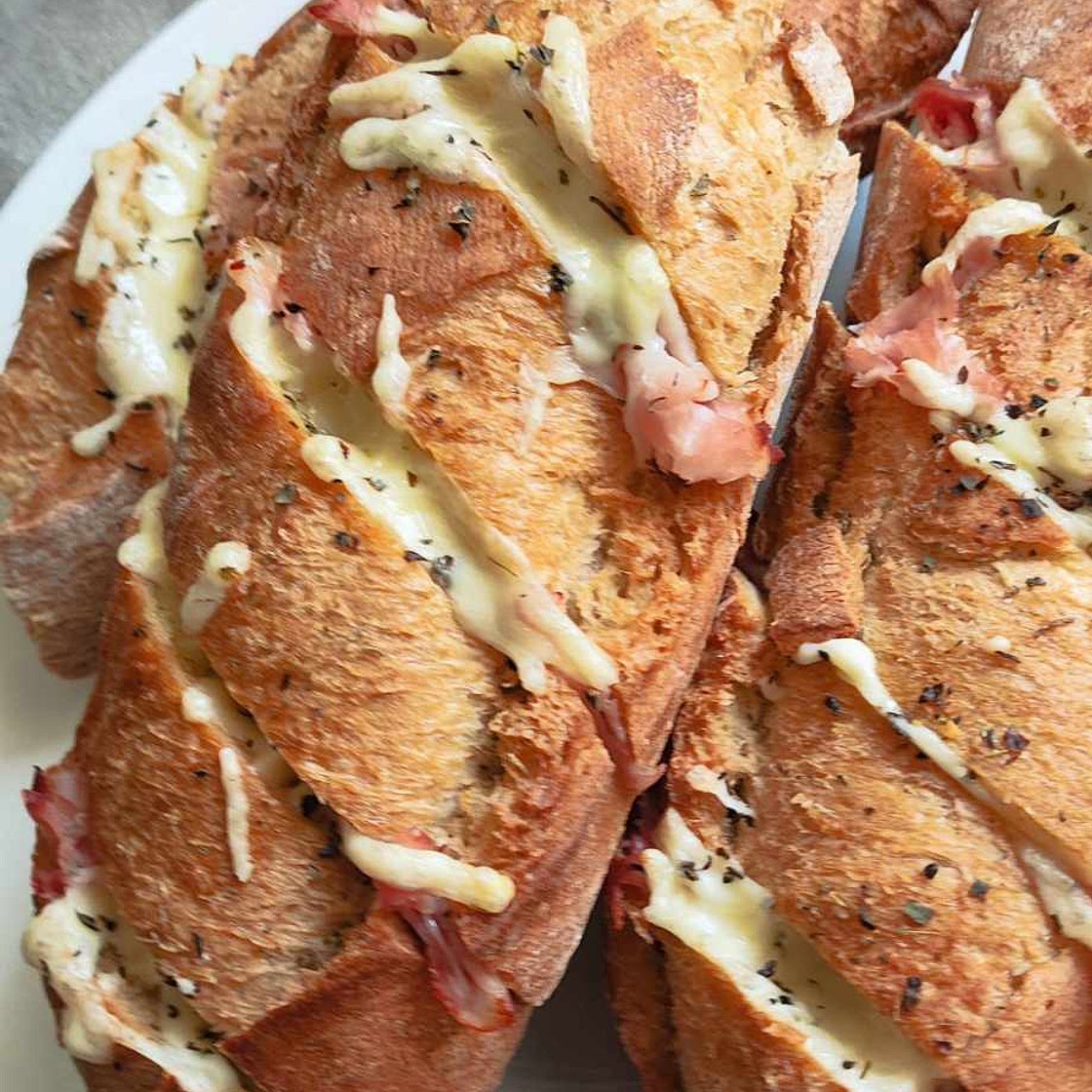 Home made garlic baguettes with prosciutto cotto and cheese