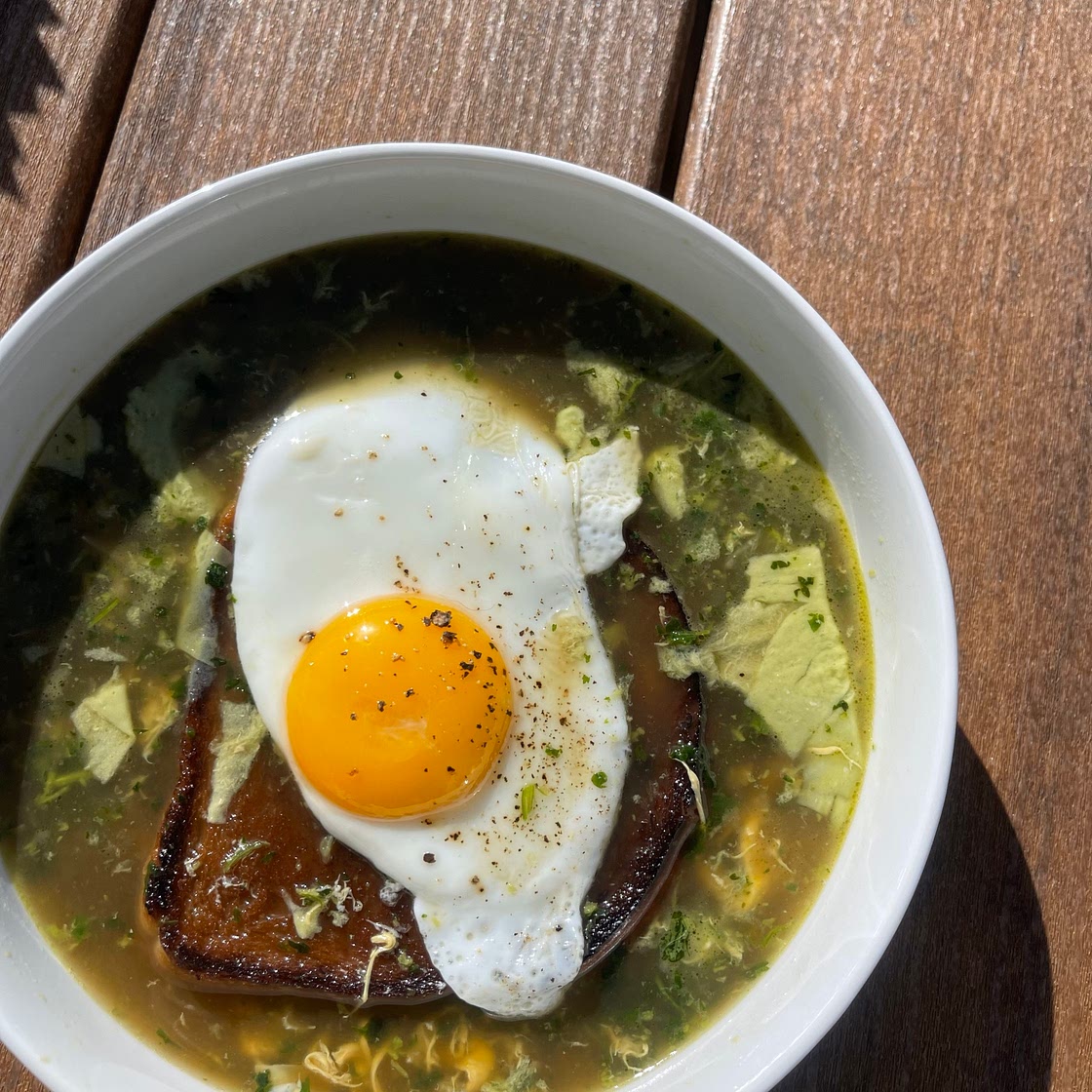 Açorda à Alentejana ( cilantro garlic broth with toast and a sunny side up egg)
