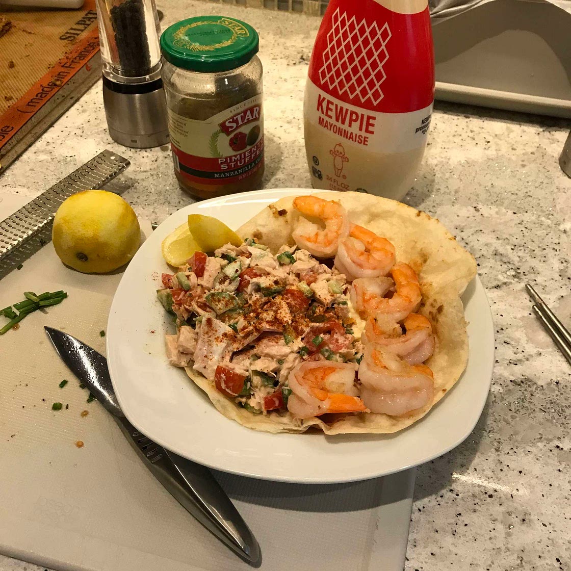 Tuna and shrimp salad with lemon zest, cucumber, and paprika