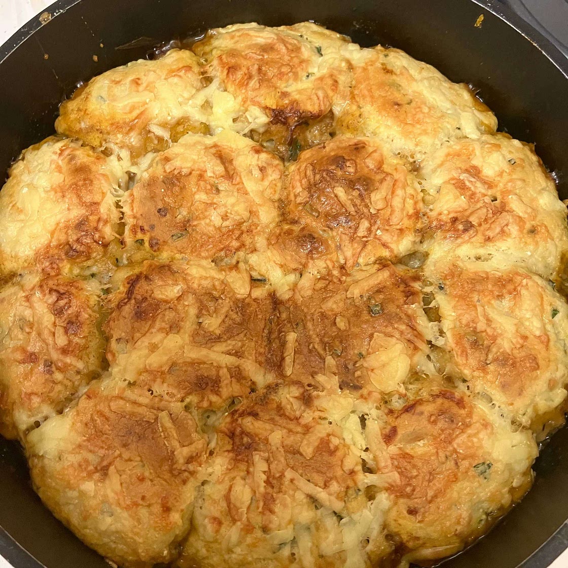 Barbecue spiced beef stew with cheesy scone topping