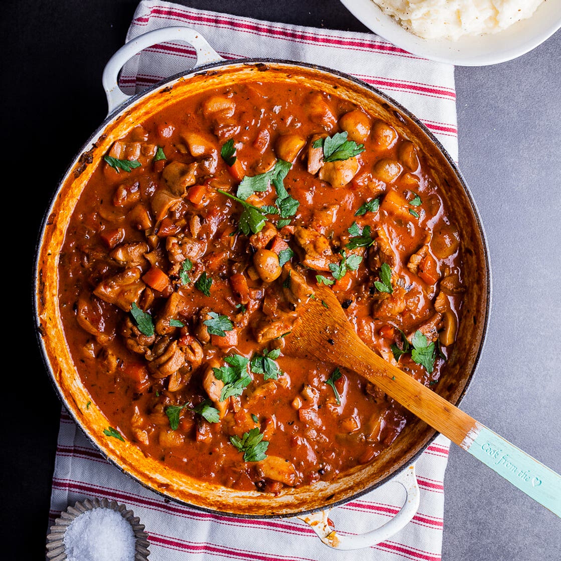 Chicken, tomato and mushroom stew with garlic Parmesan mash