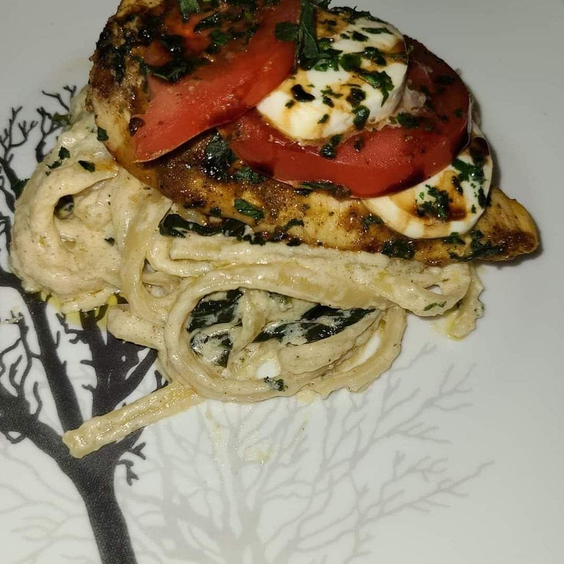 Chicken Caprese with fettuccine alfredo.