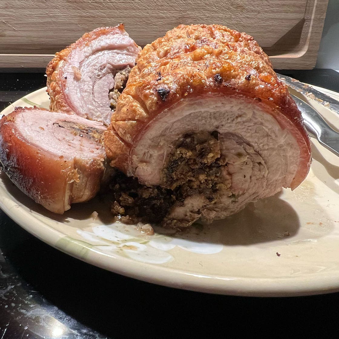 Prune and apple stuffed pork belly with roast fennel and apples