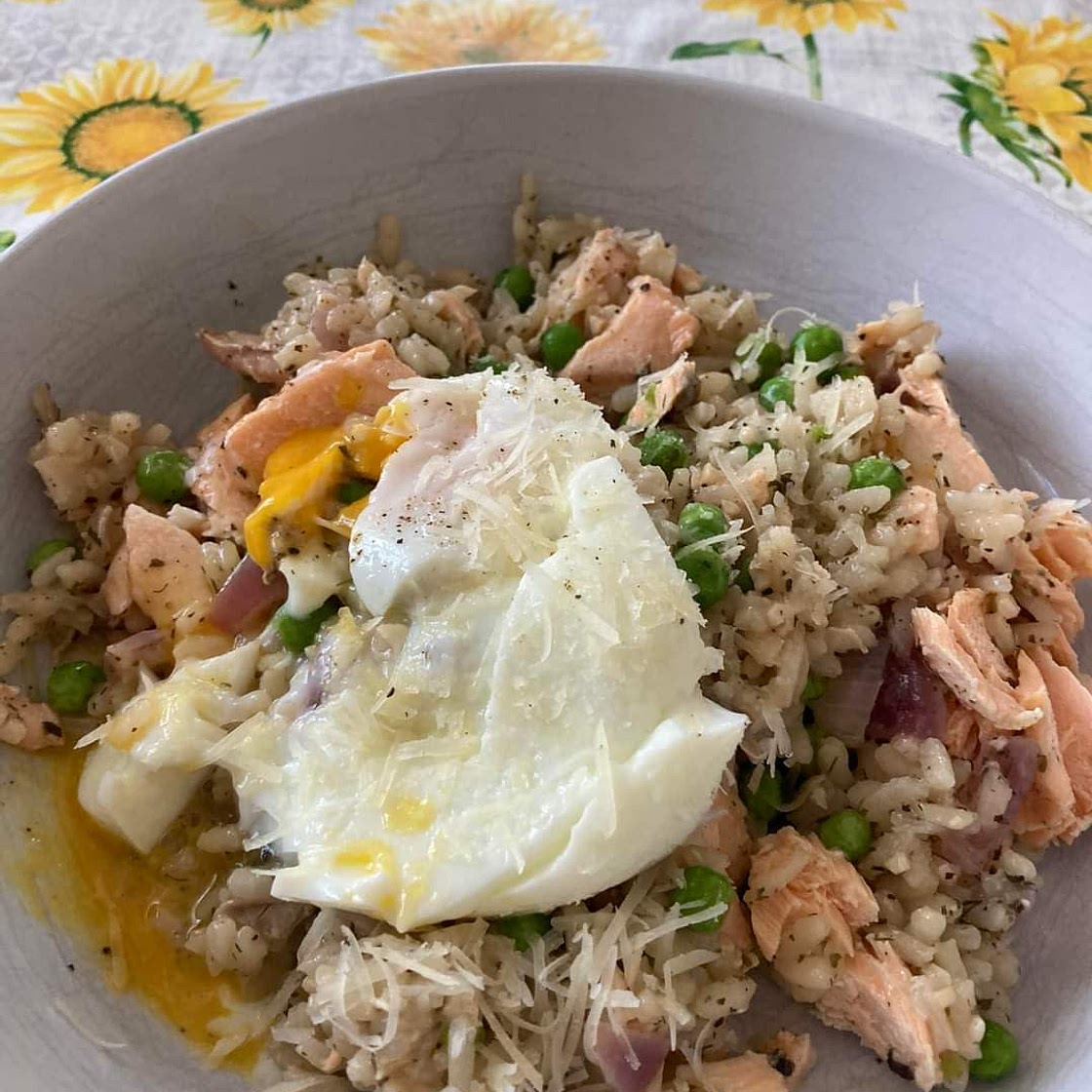 Salmon, pea and lemon Risotto topped with a poached egg