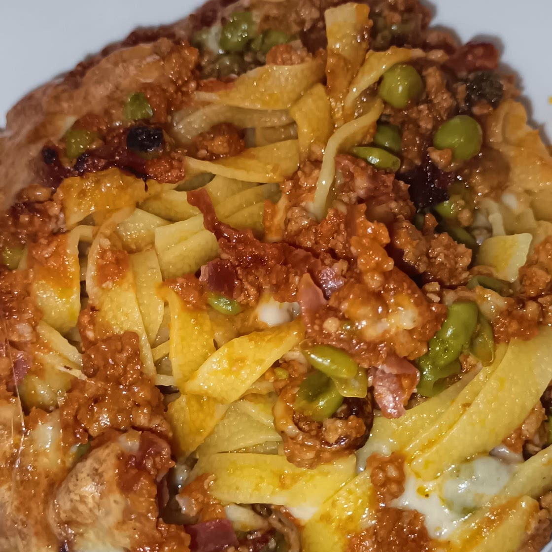 Tagliatelle al forno piselli e capocollo