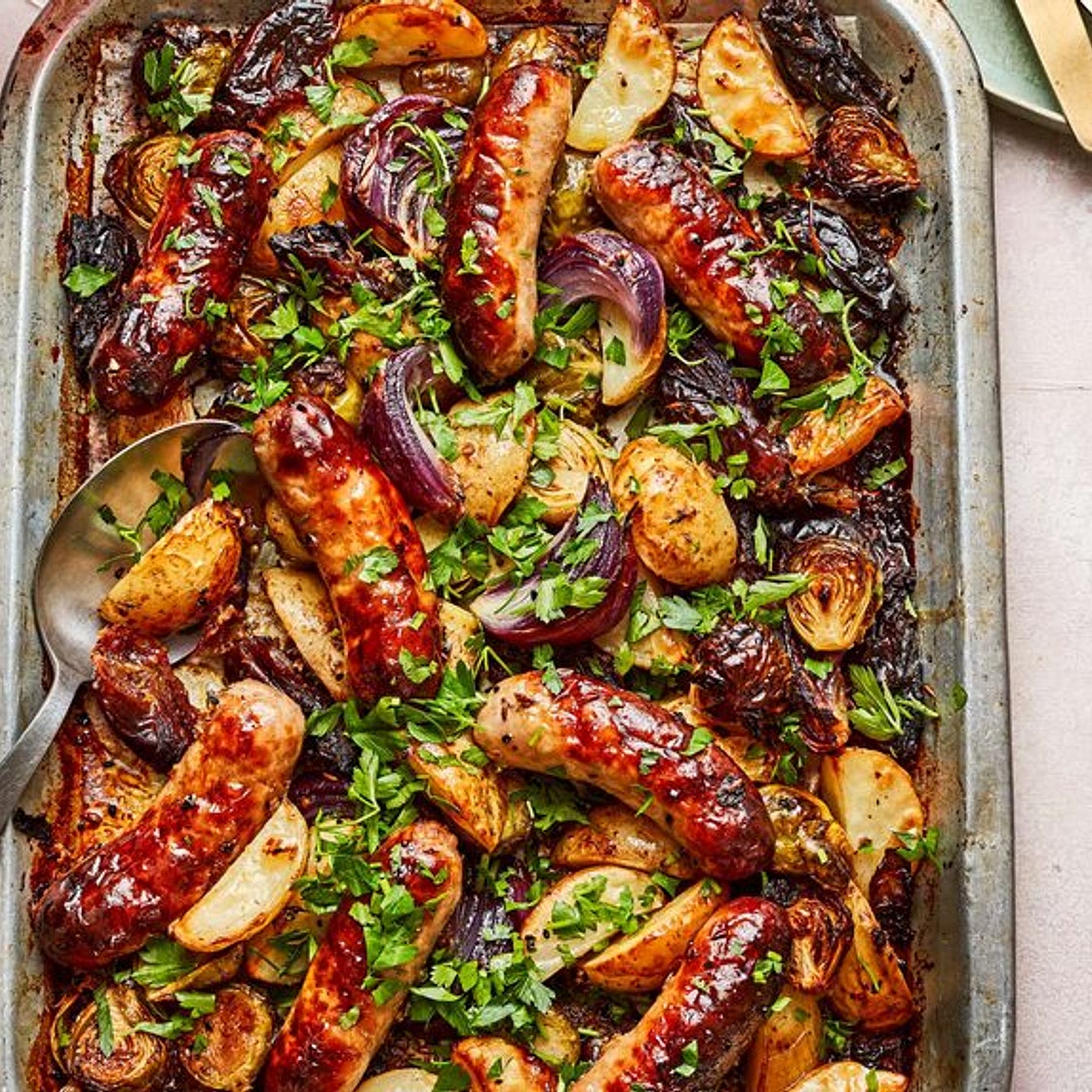 Sticky date and sausage traybake