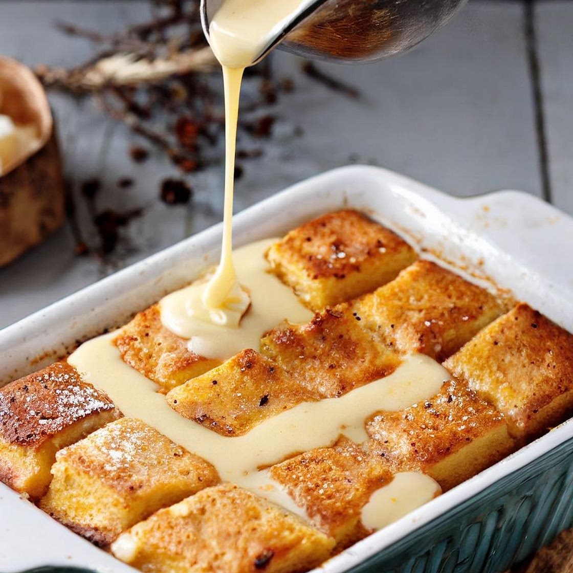 Bread Pudding in Casserole with Vanilla Sauce