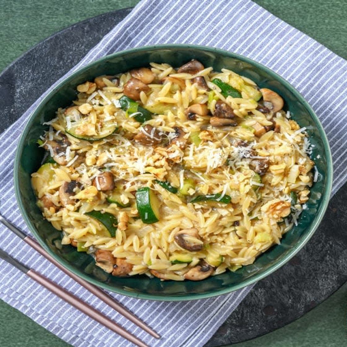Mushroom risotto with orzo, zucchini, walnuts, and pecorino