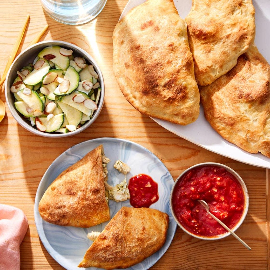 Cheesy Pesto Chicken Calzones with Tomato Sauce & Marinated Zucchini