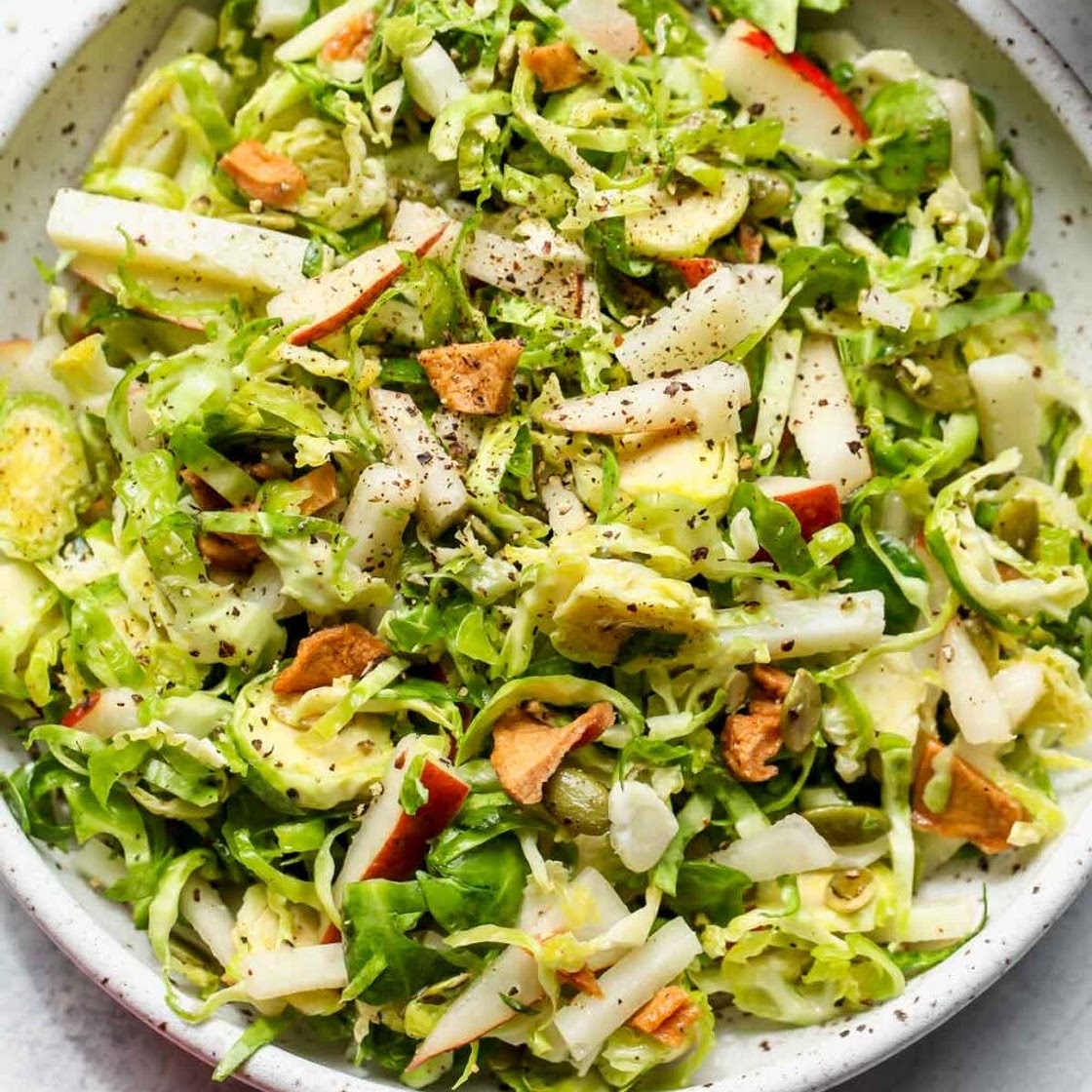 SHAVED BRUSSELS AND PEAR SALAD WITH MANCHEGO