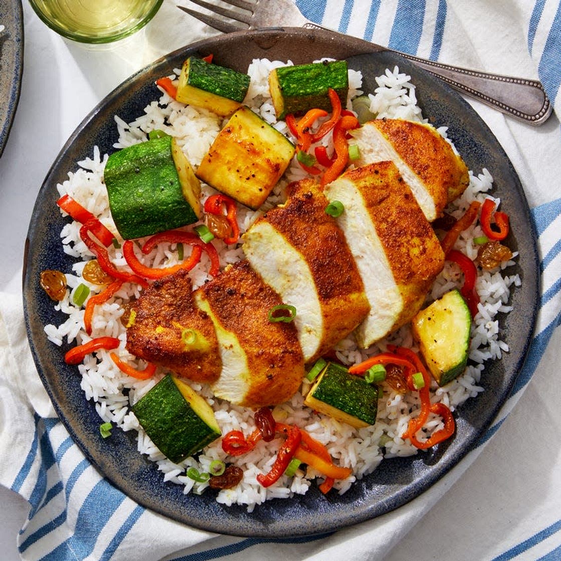 To elevate our fragrant Vadouvan-coated chicken breasts, we’re serving a sweet-and-spicy dipping sauce made from honey and spice