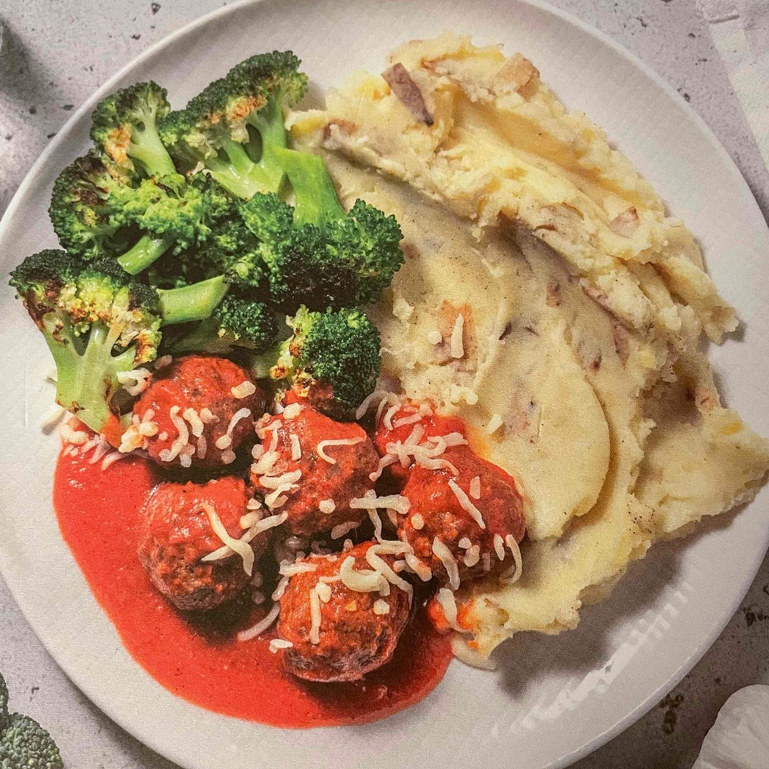 Meatballs in Cajun tomato sauce with mash