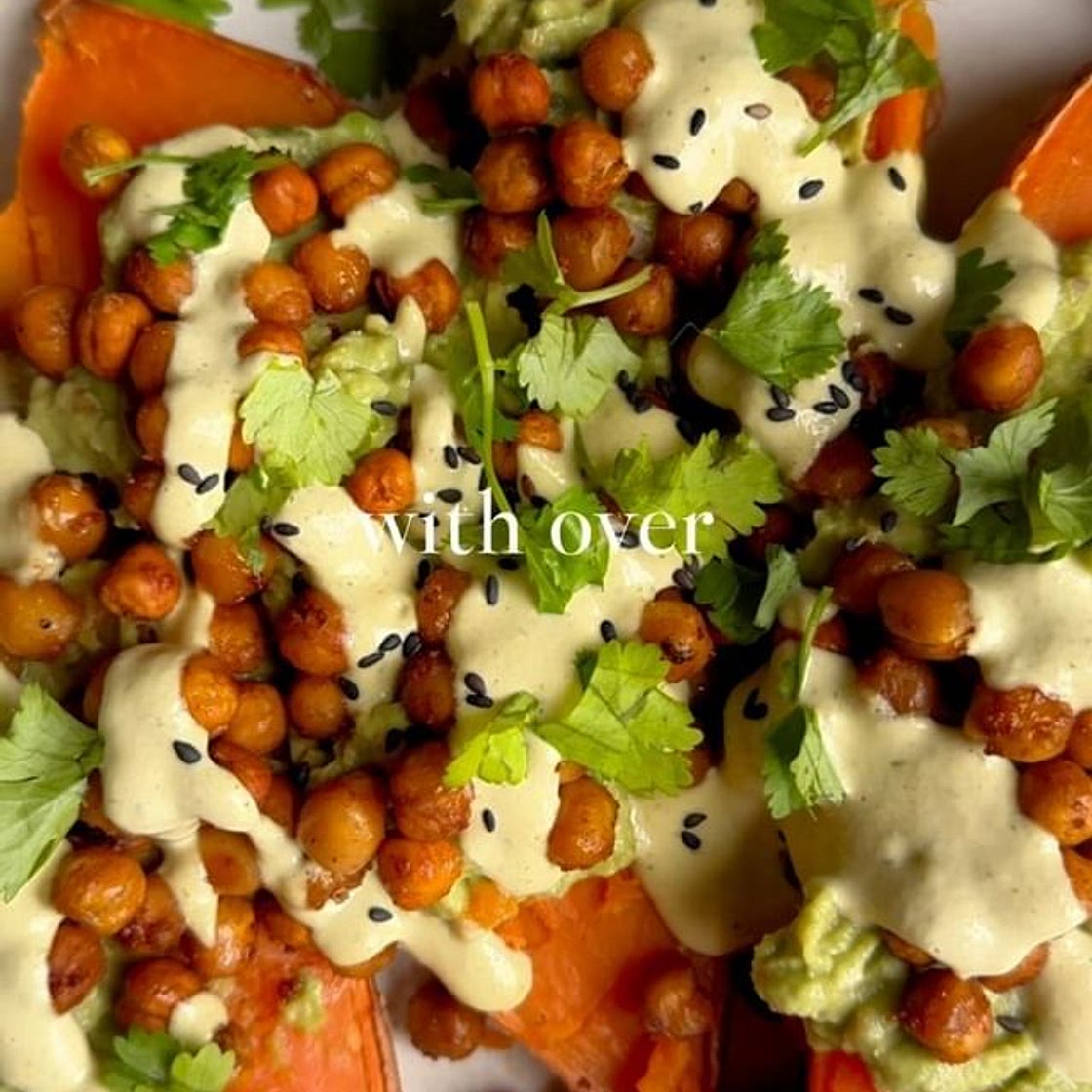 SMOKY CHICKPEAS LOADED SWEET POTATO WITH AVOCADO AND HERBY SAUCE