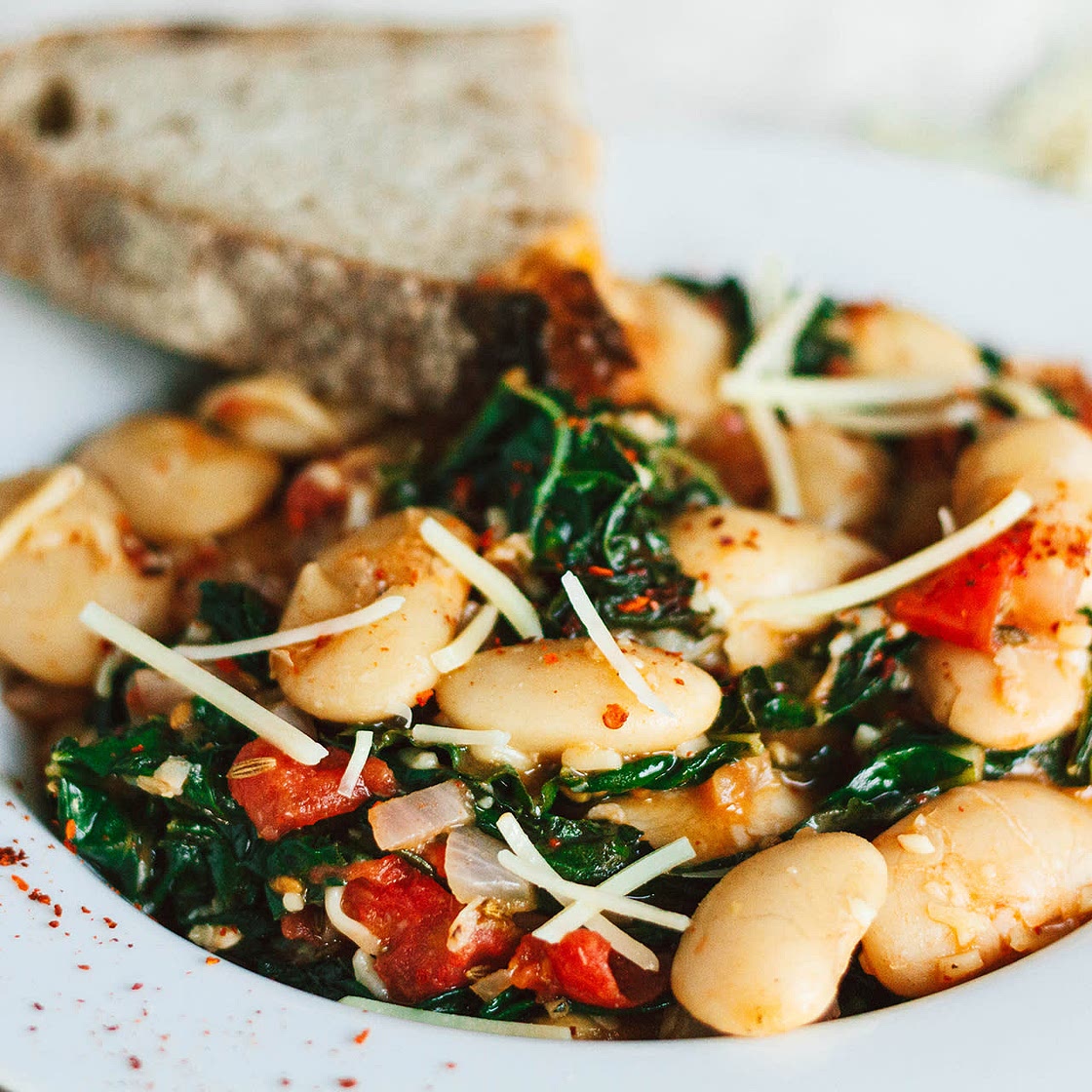 Saucy White Beans with Tomatoes, Greens, and Garlic
