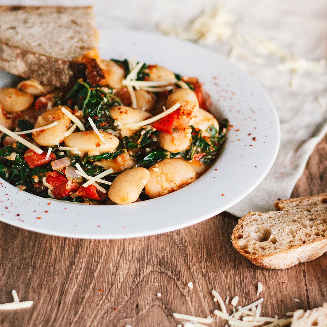 Saucy White Beans with Tomatoes, Greens, and Garlic