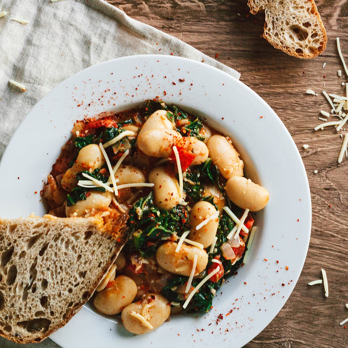 Saucy White Beans with Tomatoes, Greens, and Garlic
