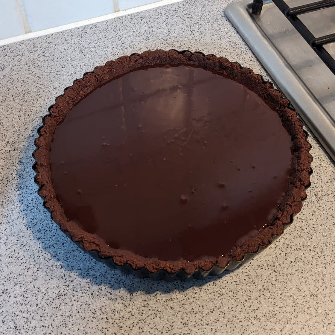 Rich chocolate tart with salt flakes