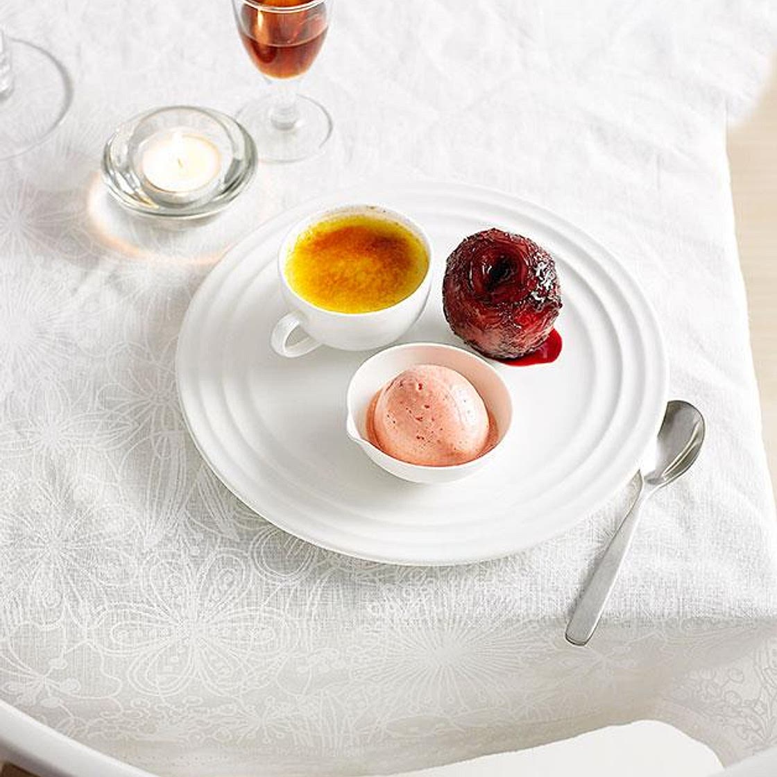 Muscat creme brulee with poached plums and plum sorbet