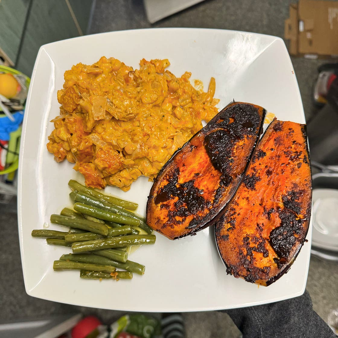 Chipotle aubergine steak with creamed corn and a herby green sauce