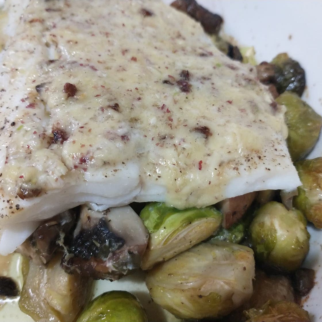 Butter-baked fish with Brussels sprouts and mushrooms