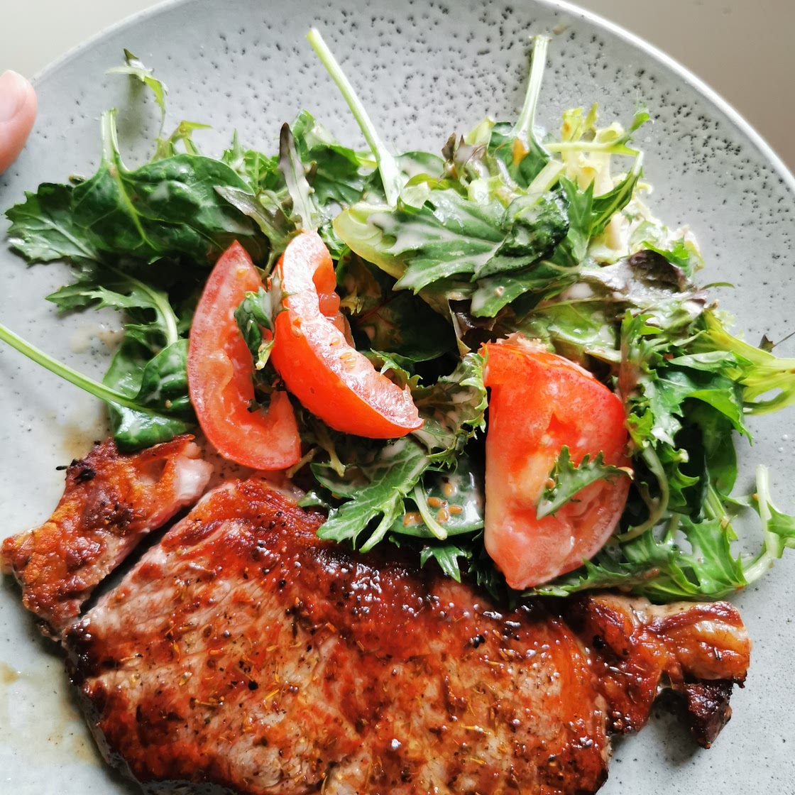 Porterhouse steak with salad in sesame dressing