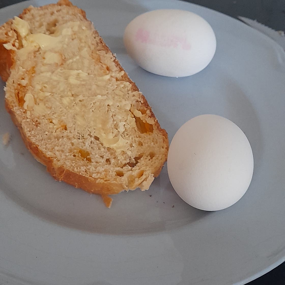 2 sot boiled eggs and 1 piece of bread and butter