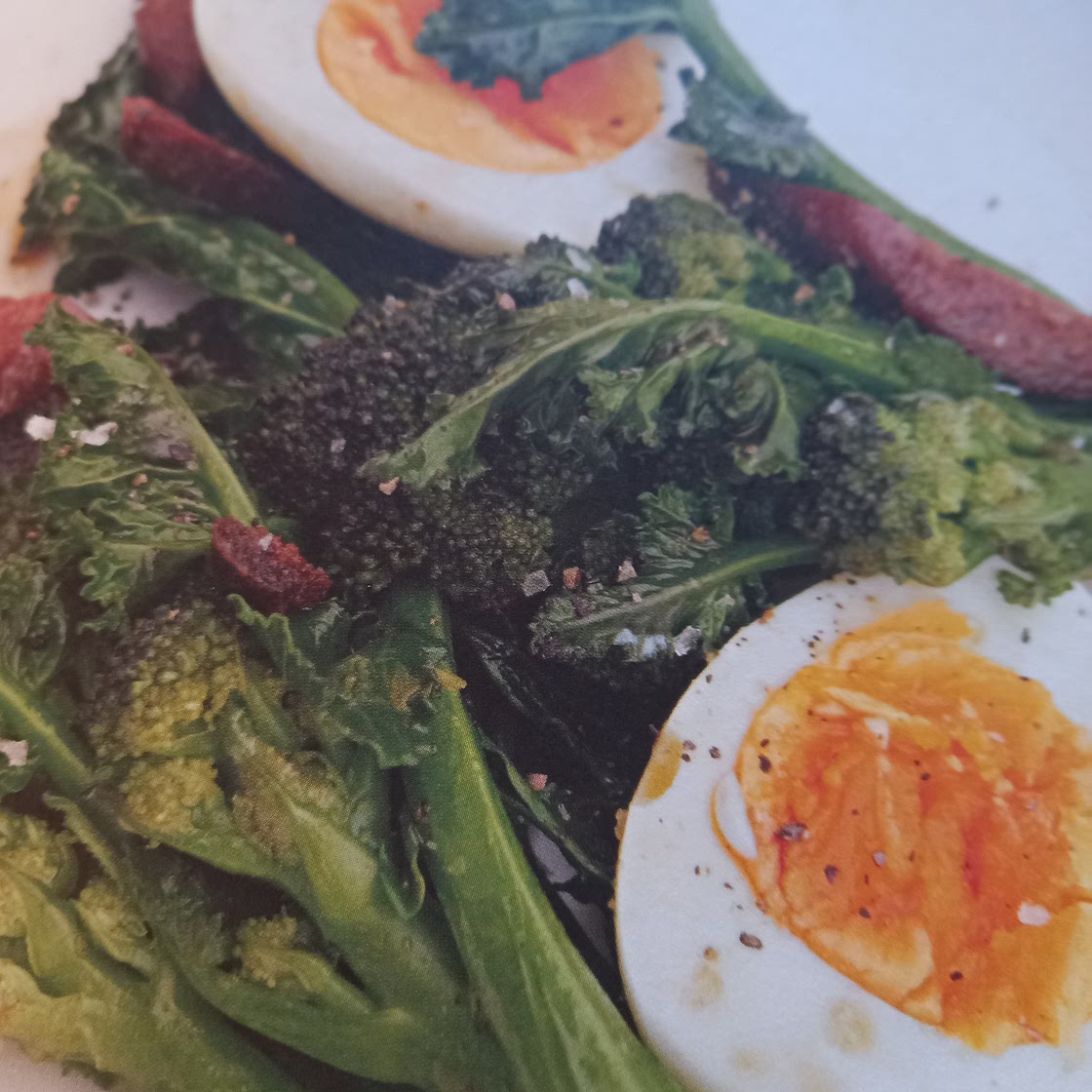 Purple sprouting broccoli with chorizo and eggs