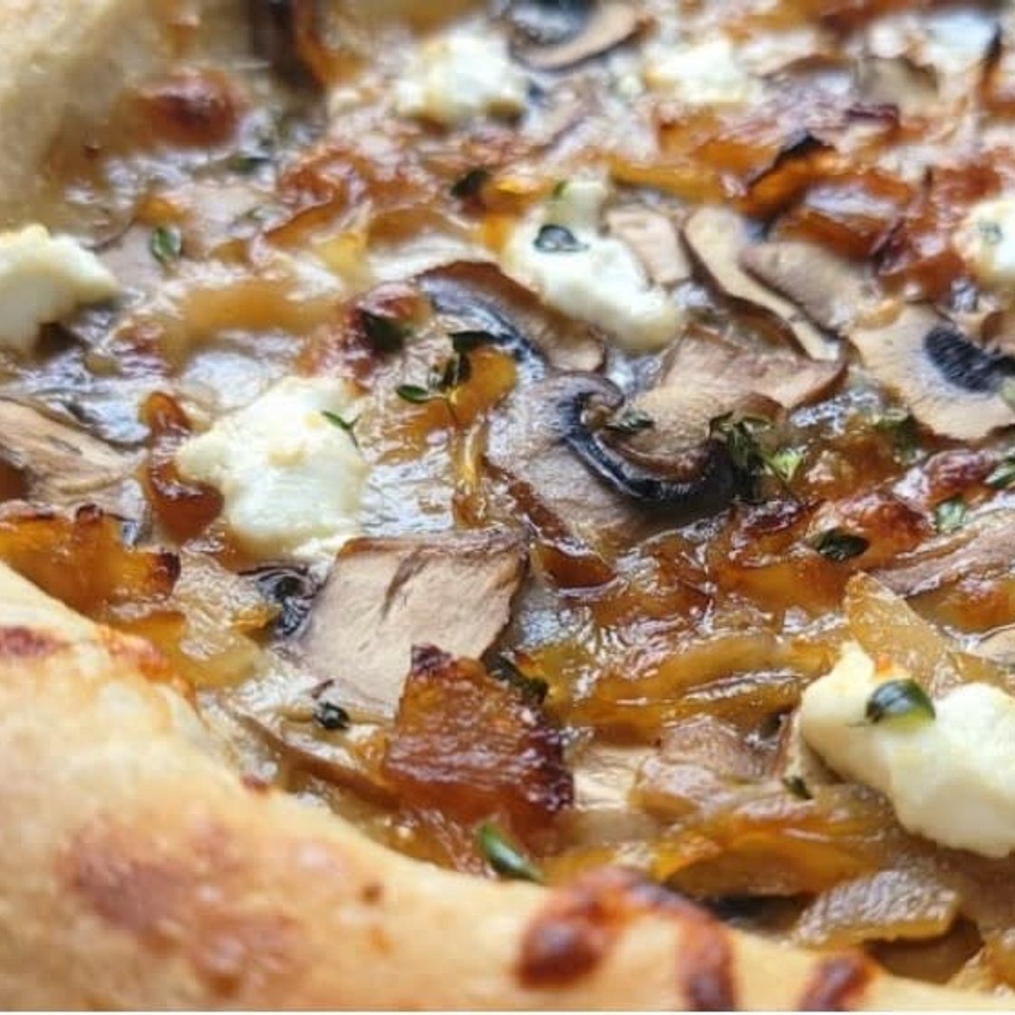 Sourdough pizza with fig jam and caramelized onions